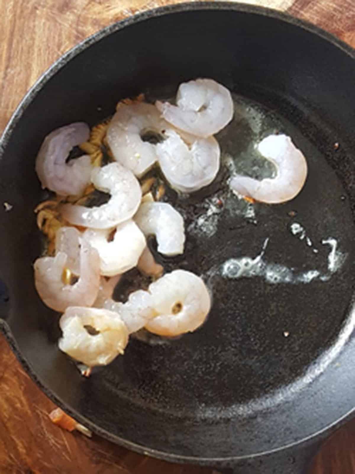shrimp are added to the pan