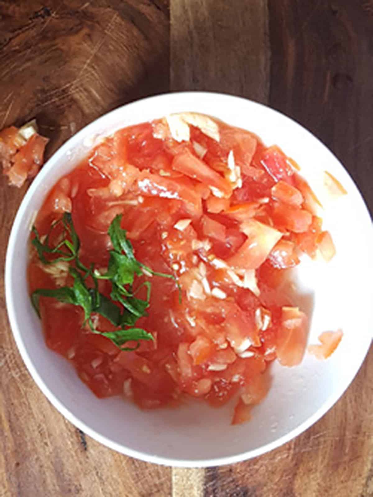the bruschetta sauce is prepped in a bowl