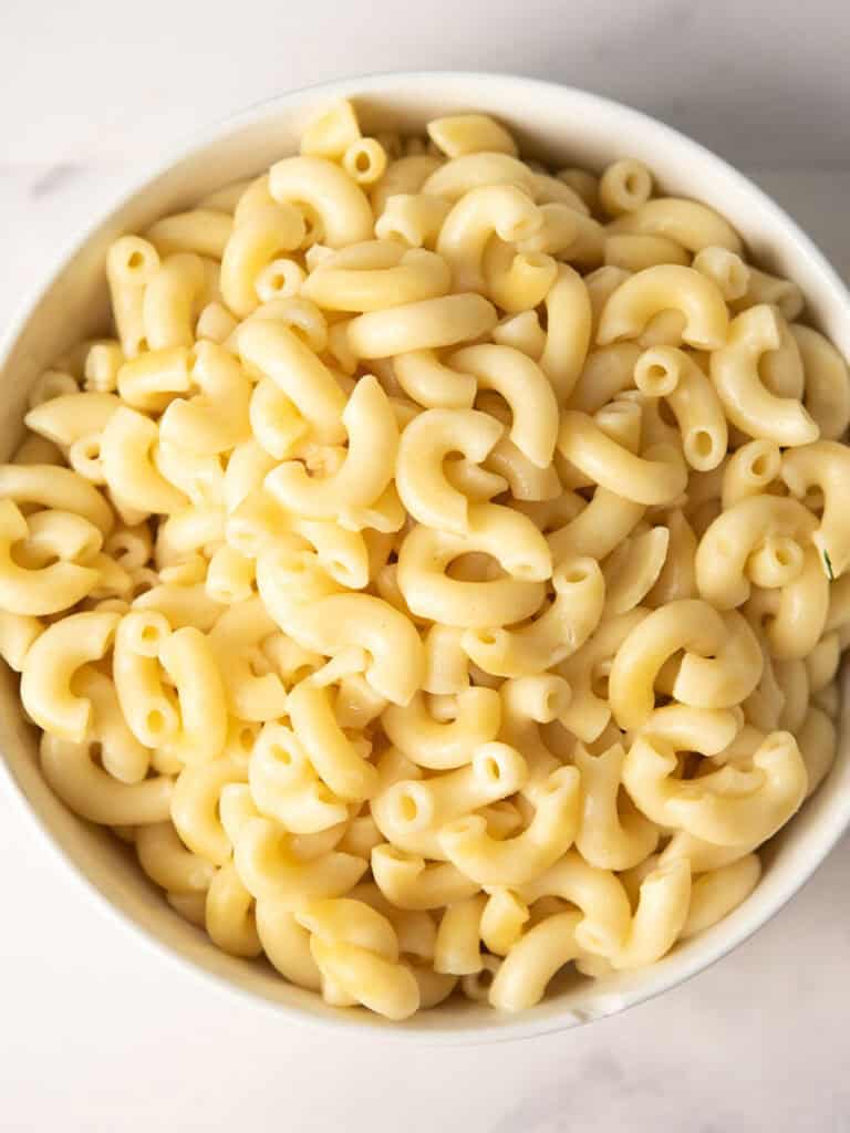 cooked macaroni pasta in a bowl for making curry mac and cheese