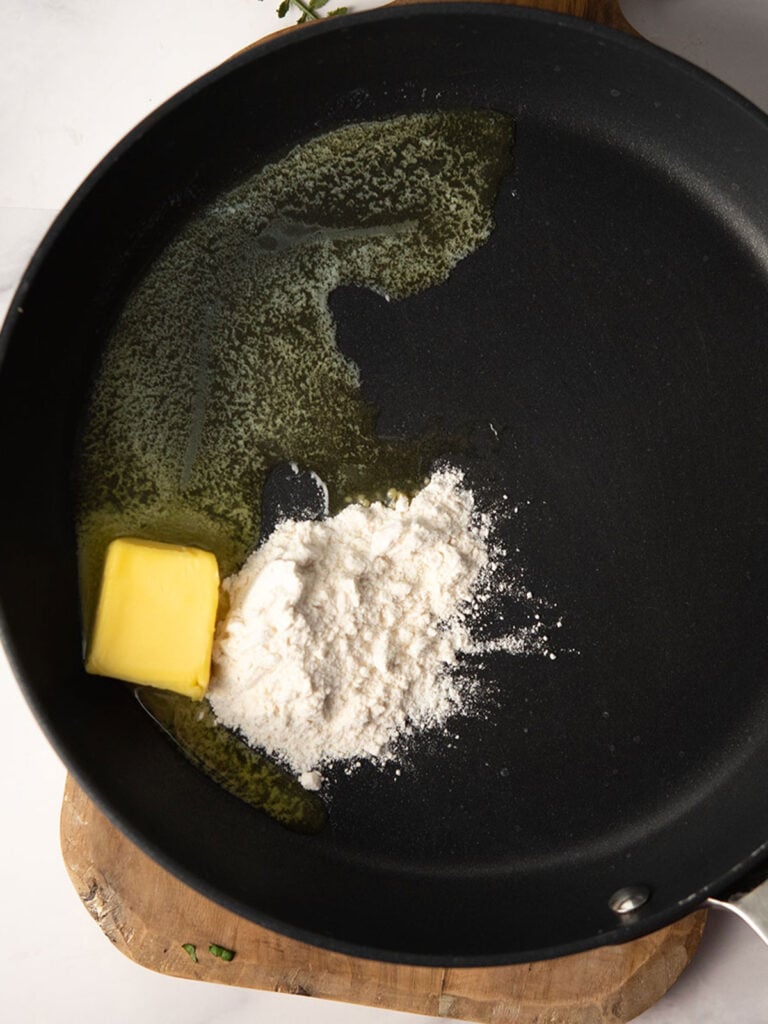 making roux with flour and butter for making curry mac and cheese