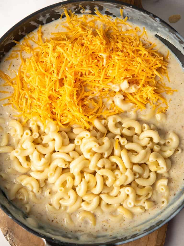 grated cheese and cooked macaroni added to the pasta