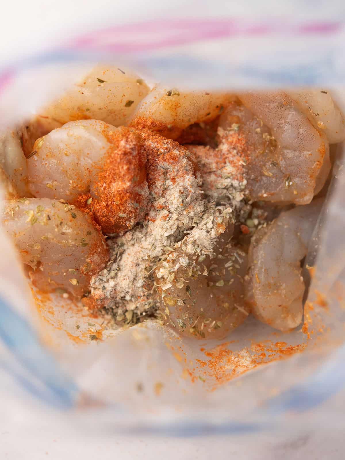 shrimp with the spices for marinations for making cajun shrimp