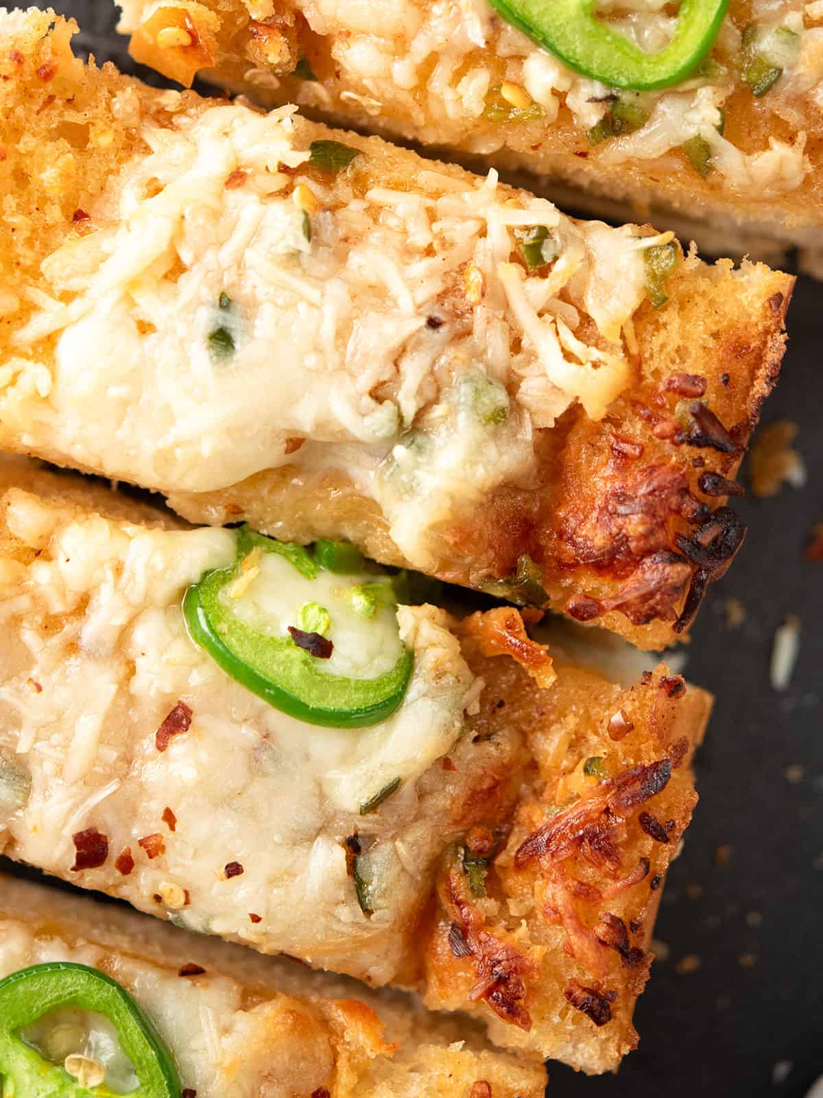 sliced jalapeno garlic bread with cheesy top