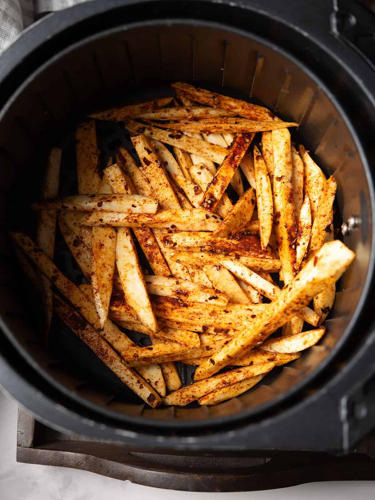 step 3 - arrange the fries in single layer in the air fryer for making Japanese sweet potato fries