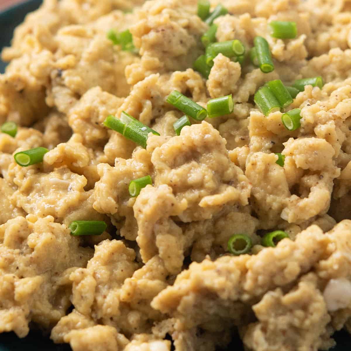 cajun scrambled eggs garnished with green onions
