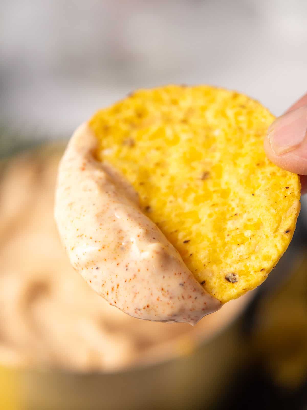 creamy Smoked paprika aioli is dripping from the chips