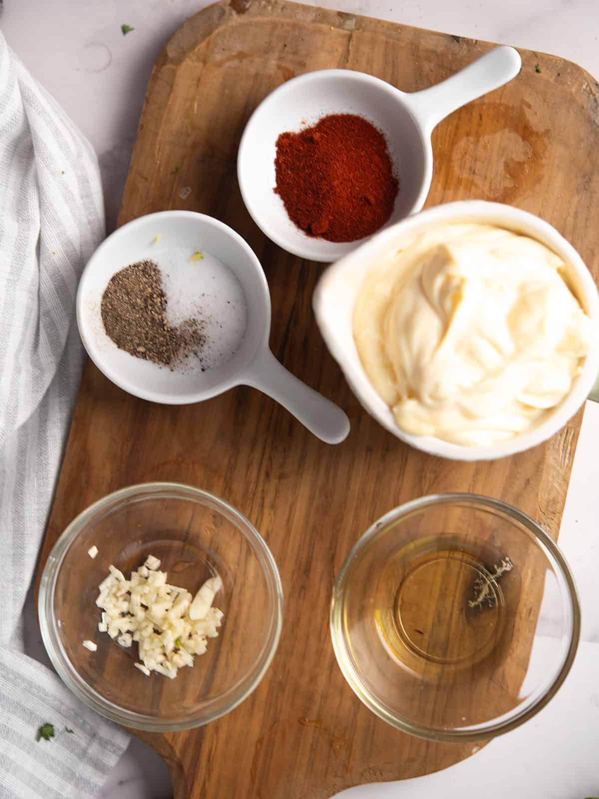 the ingredients for the Smoked paprika aioli arranged in the kitchen counter top