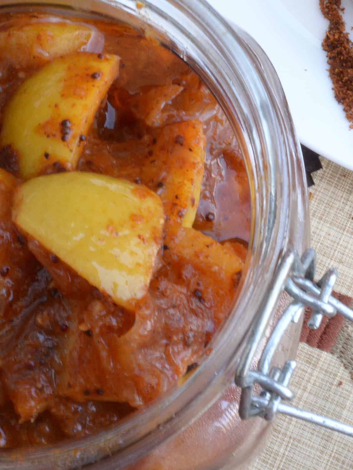 juicy, spicy south indian lemon pickle in the jar for serving