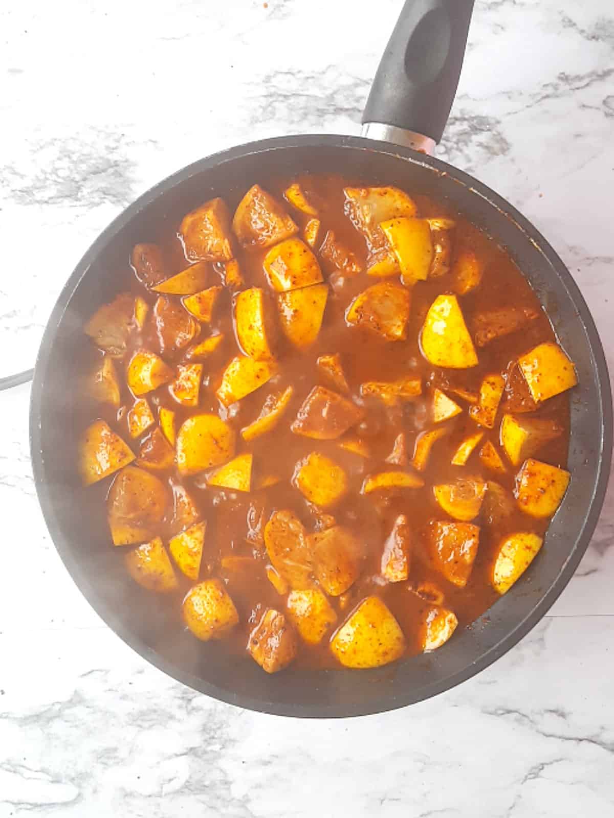 cooking lemon wedges in the pan