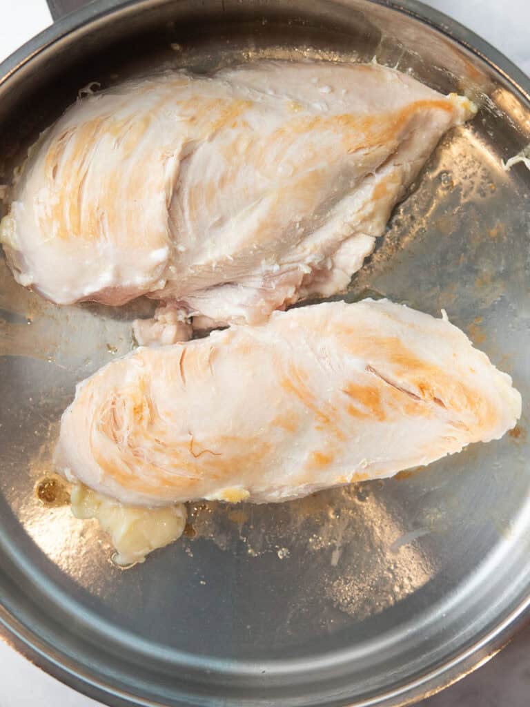searing the chicken for making spicy chicken soup