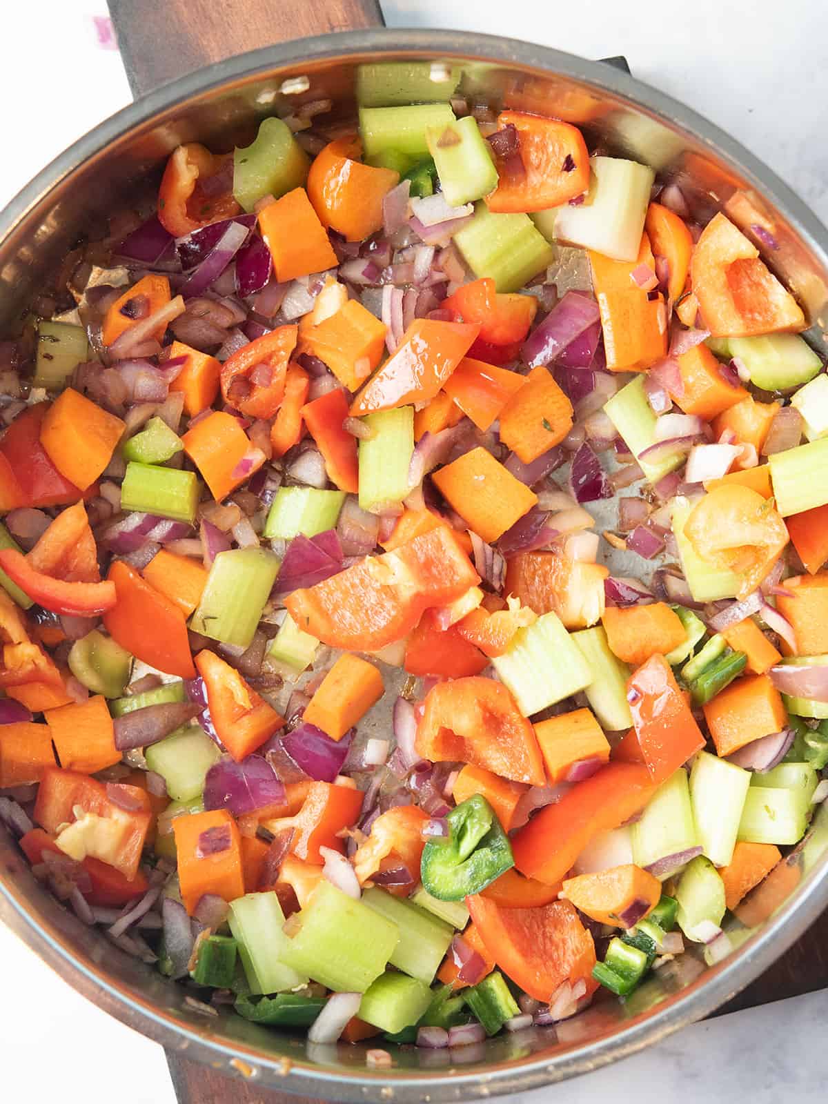 veggies are sauteed in the pan