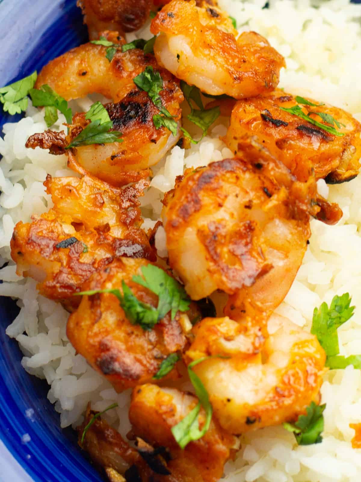 Close-up of crispy Hawaiian shrimp, showcasing golden-brown texture.
