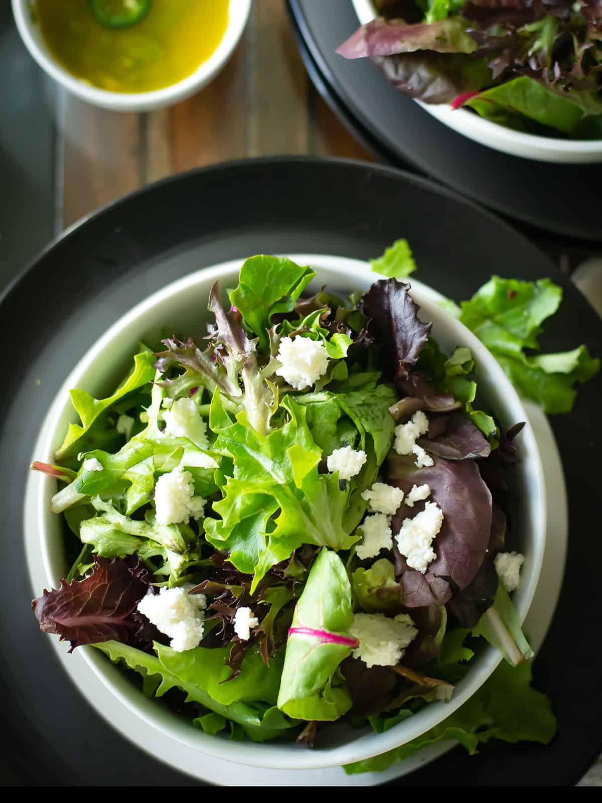 Freshly prepared Fresco Salad, garnished with crumbled queso fresco.