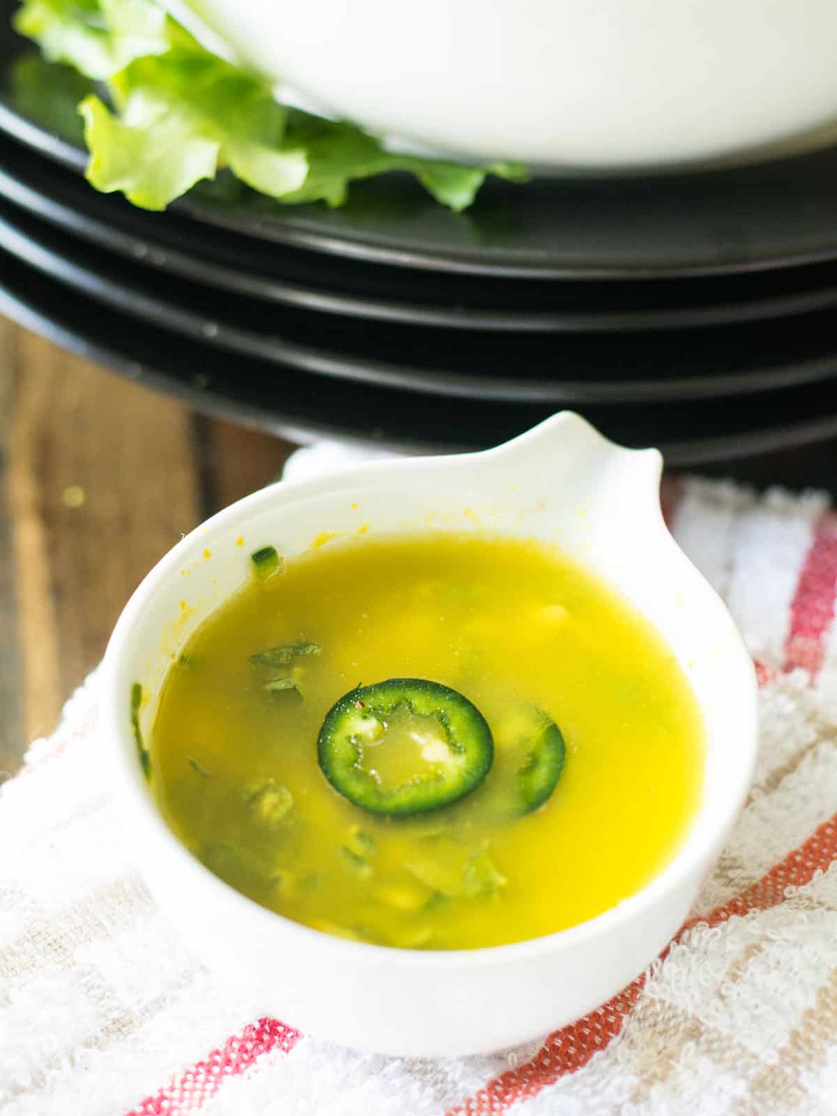 Whisking the mustard vinaigrette in a small mixing bowl until smooth.