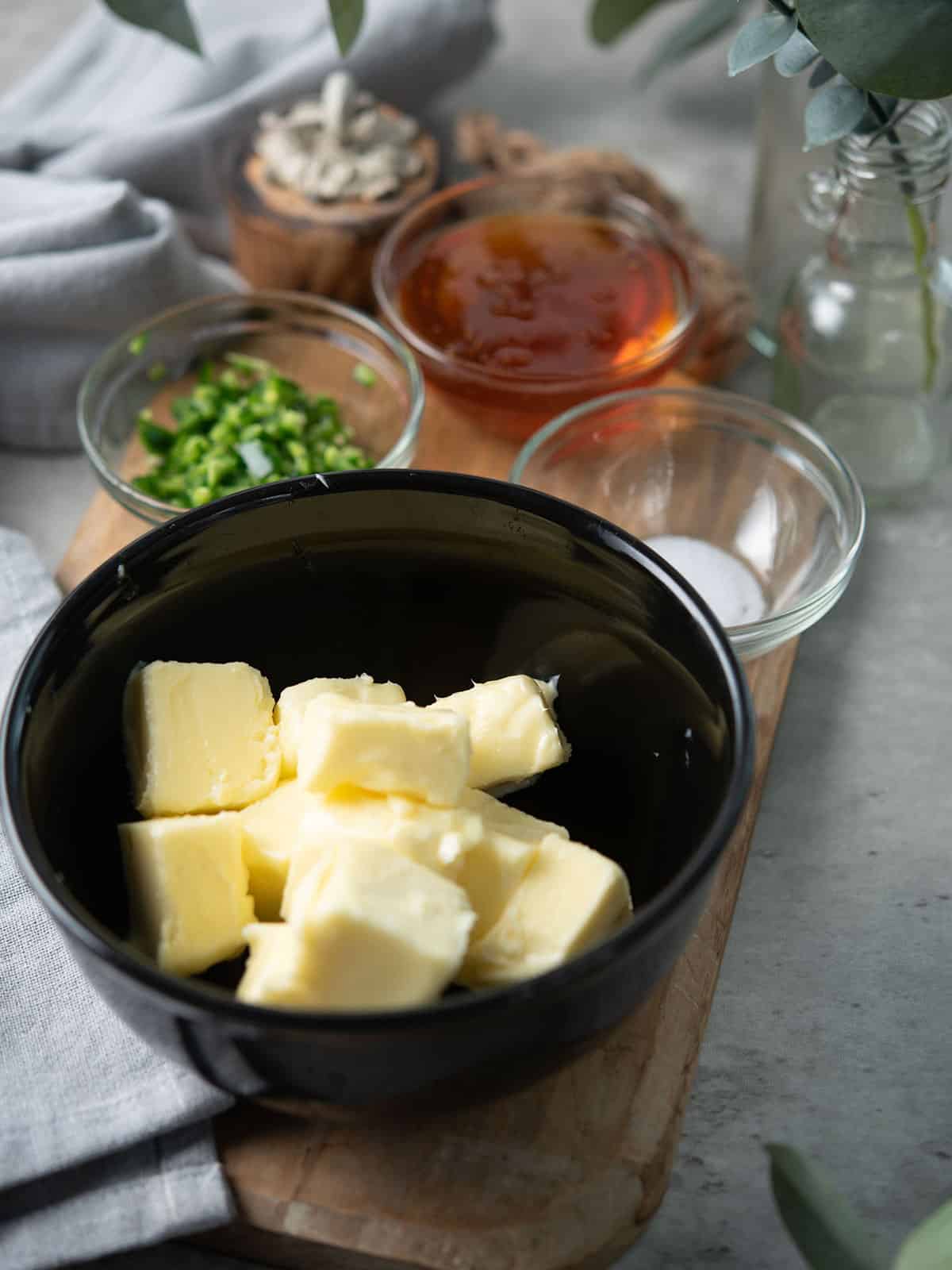 Ingredients for jalapeno honey butter: butter, jalapenos, honey, and salt.