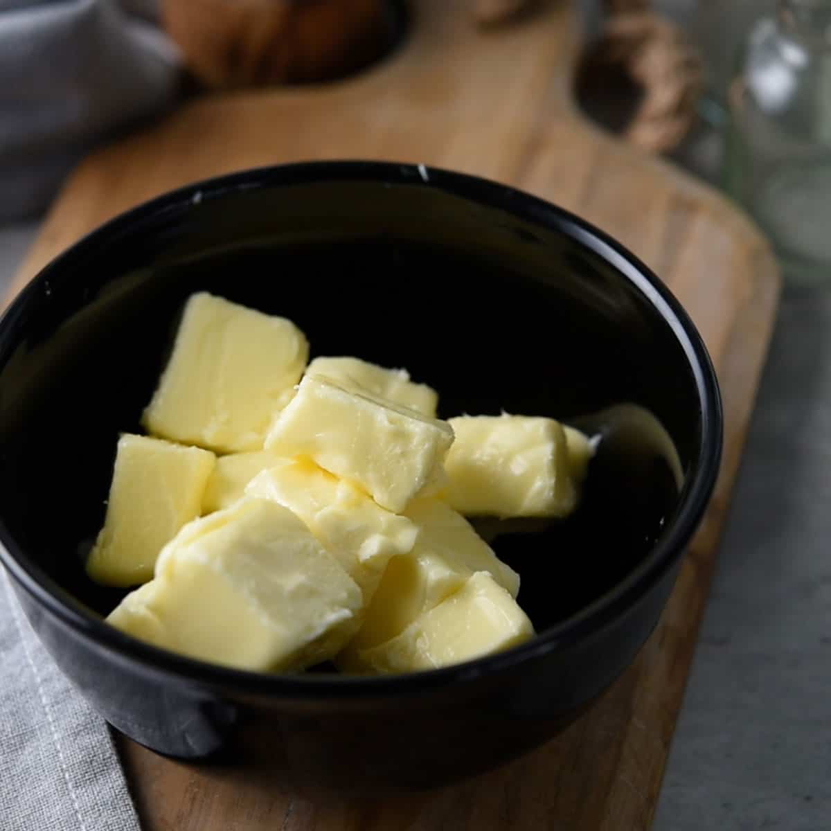 Mixing softened butter in a bowl