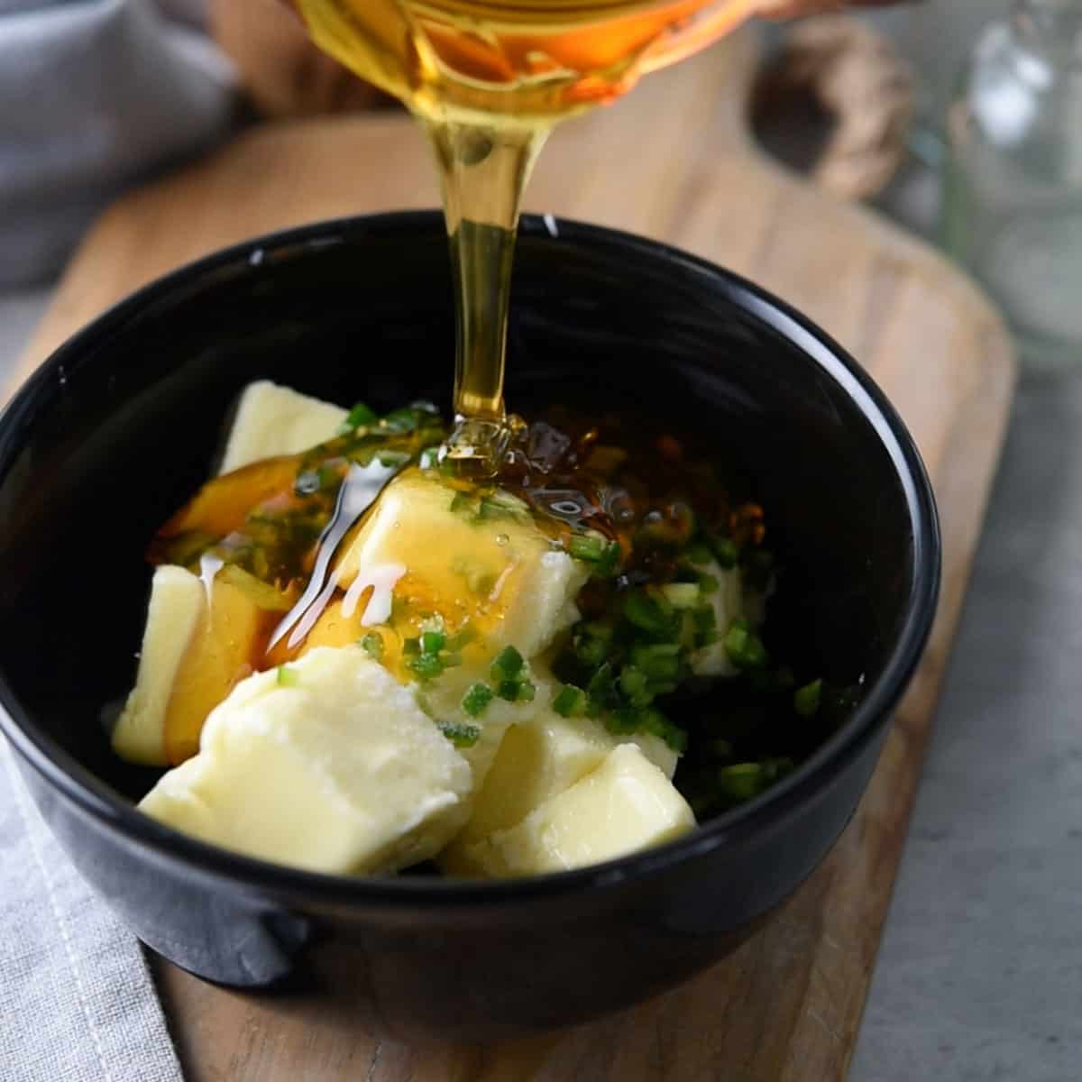 Adding honey to the bowl