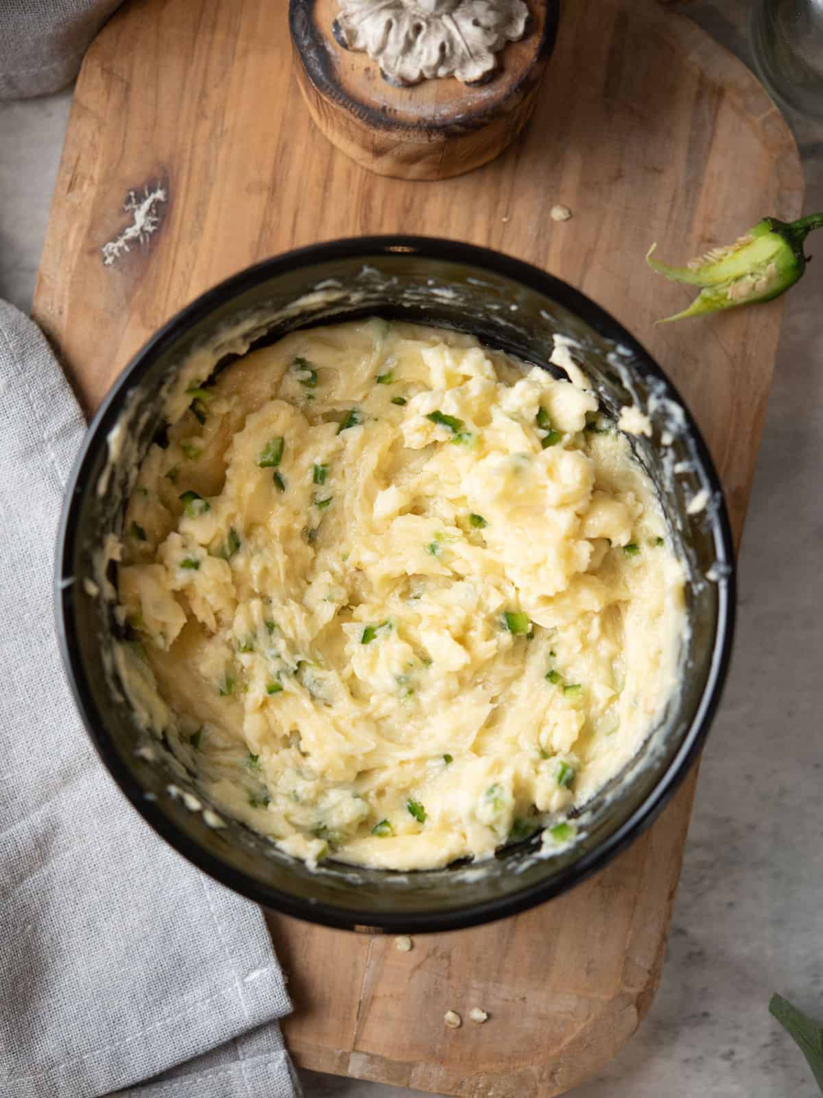 Creamy jalapeno honey butter in a small bowl, ready to serve.
