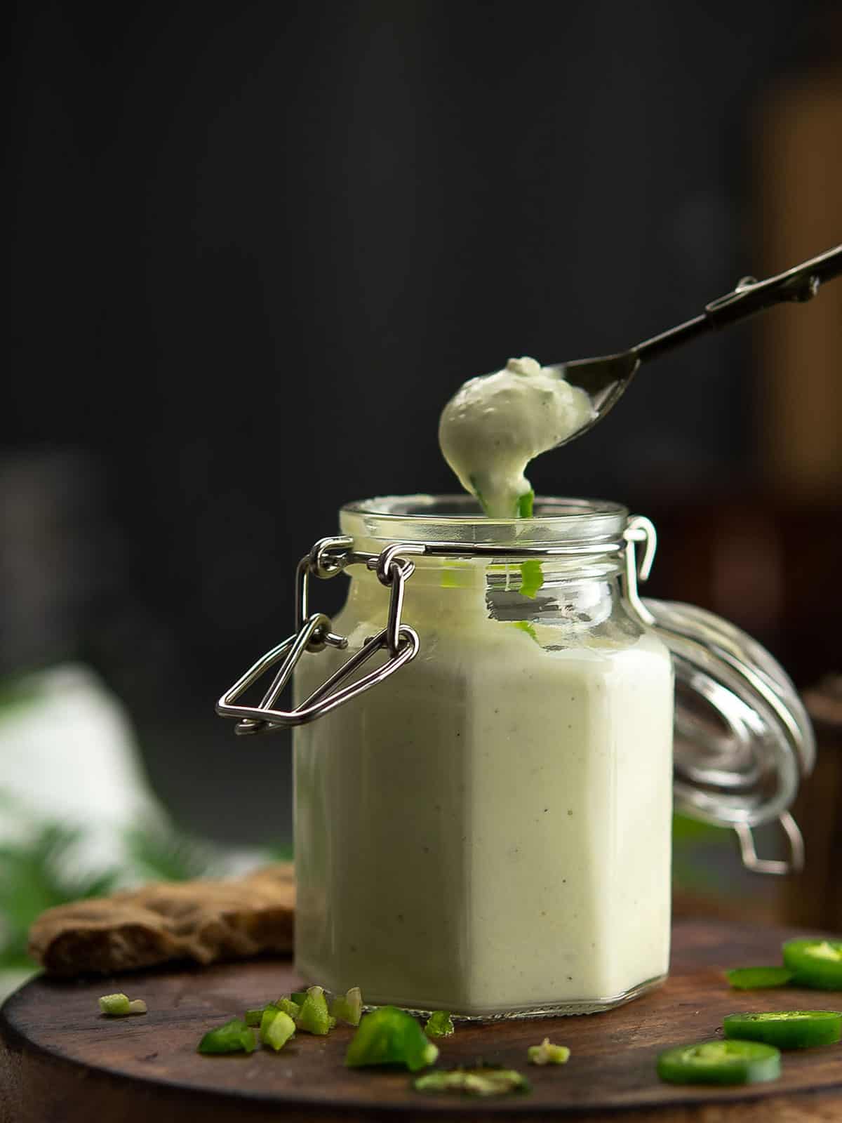 Spoonful of jalapeno ranch sauce ready for dipping.