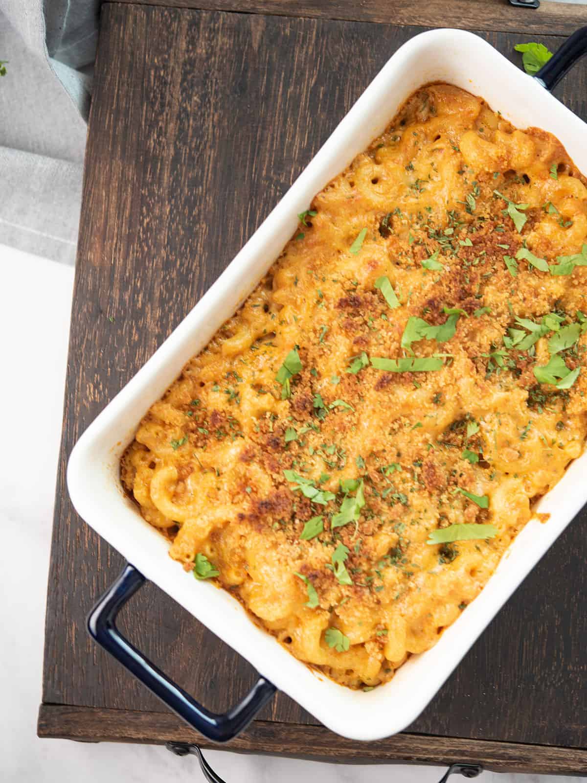 Creamy spicy mac and cheese topped with golden breadcrumbs and parsley.