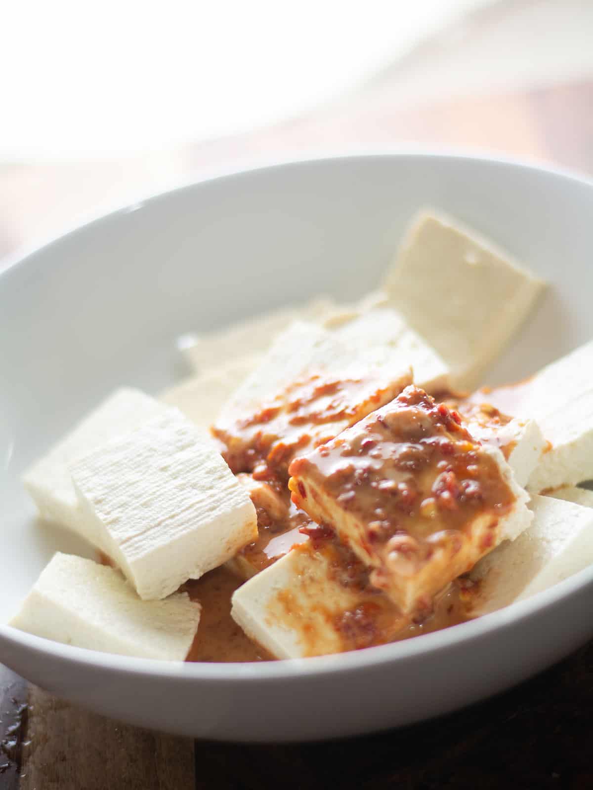 adding the marination for the tofu