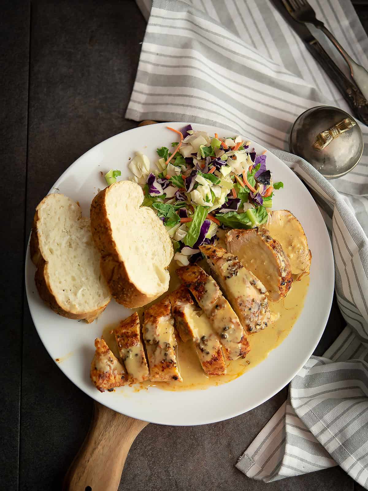 served spicy yogurt sauce as glaze over chichen served in a plate