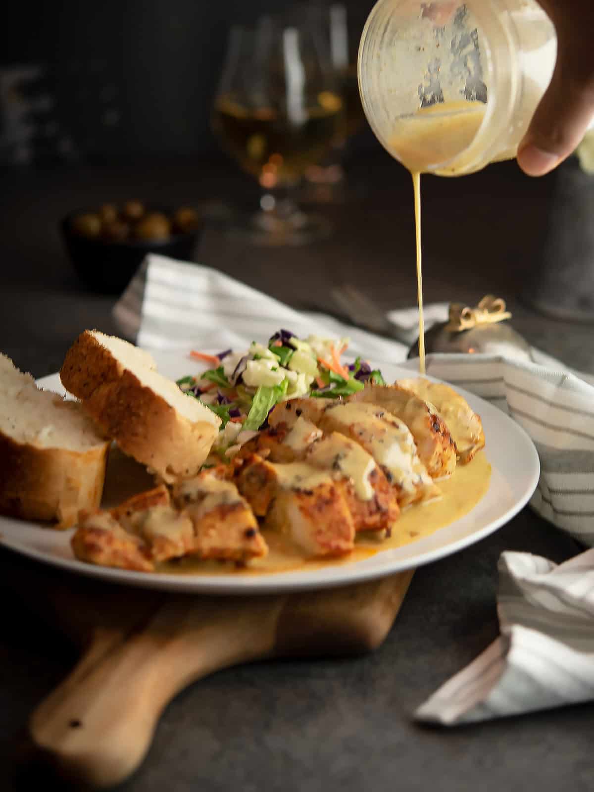 spicy yogurt sauce drizzling over grilled meat
