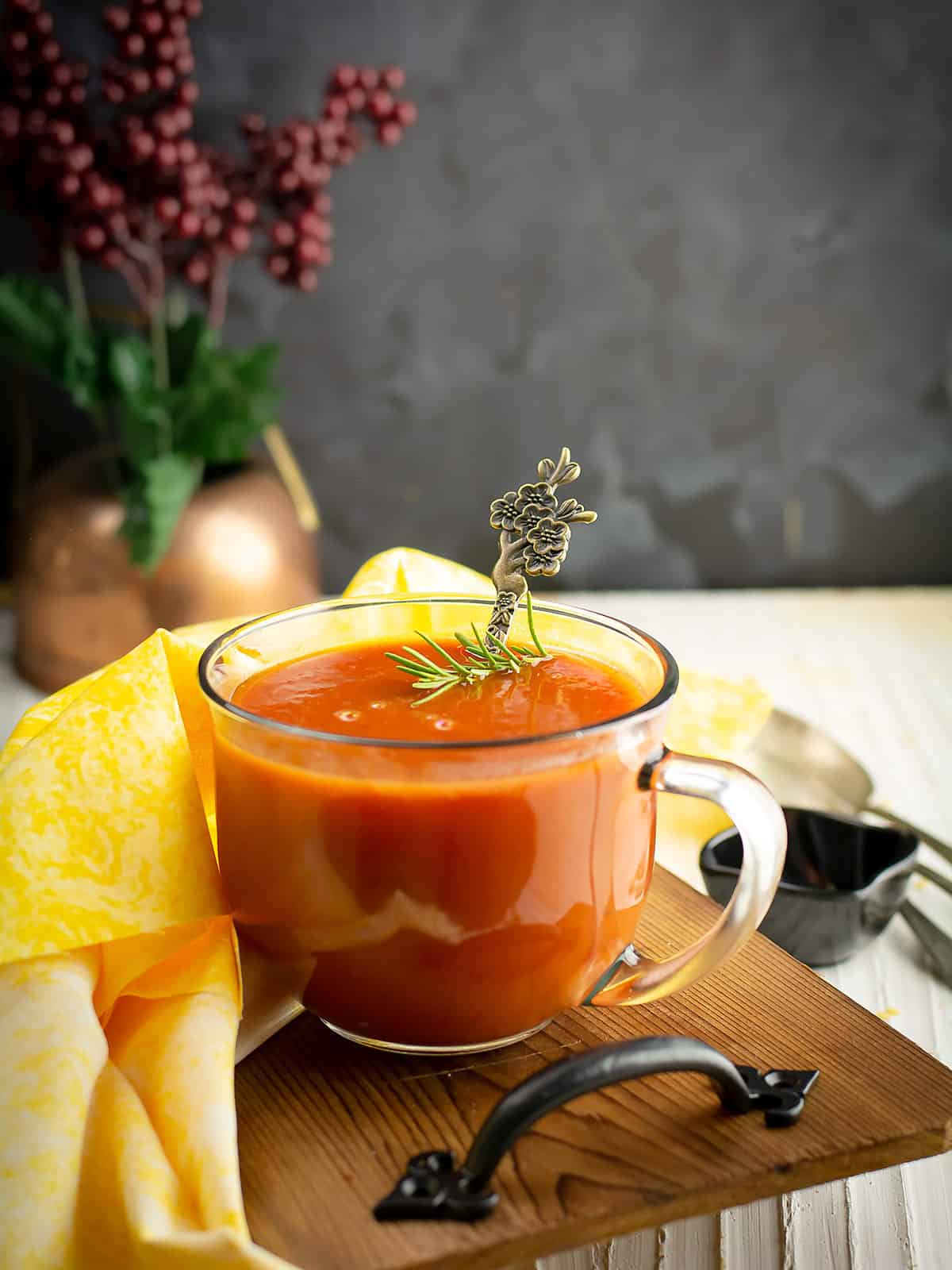 A serving of tomato soup from tomato paste over the dining table