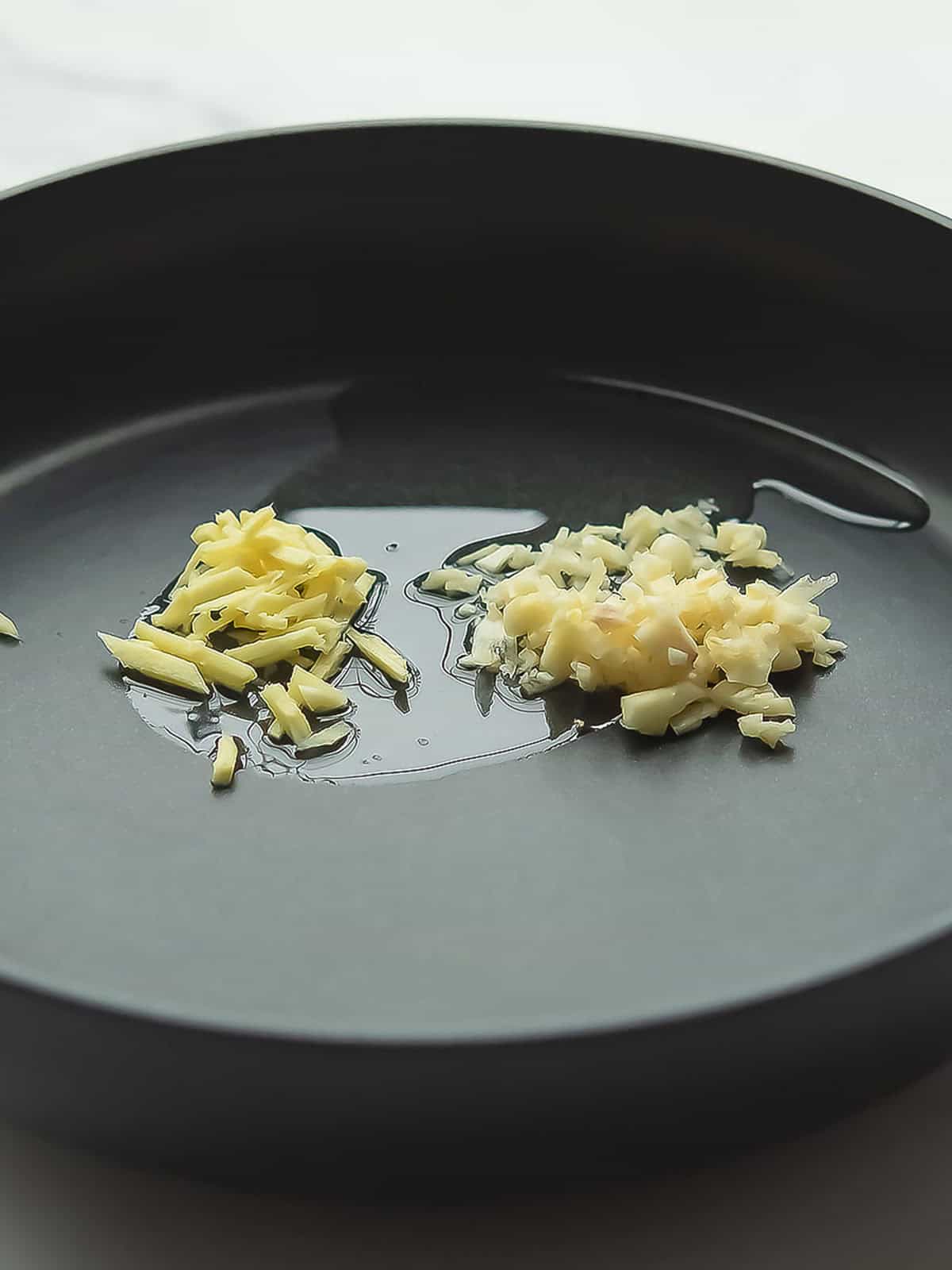 sauteing the spices in the pan