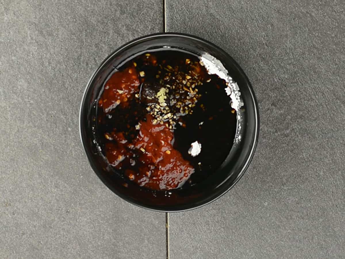 Mixing ingredients for Asian zing sauce in a bowl