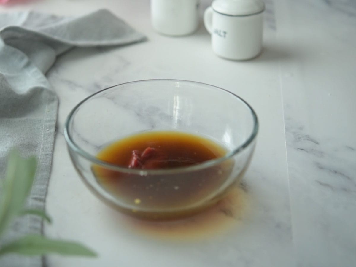 Mixing ingredients in a bowl for black pepper sauce