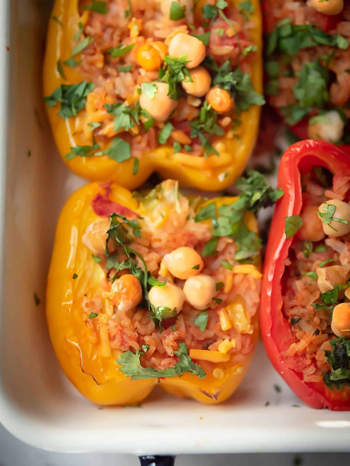 Close-up of baked chickpea stuffed peppers fresh out of the oven.