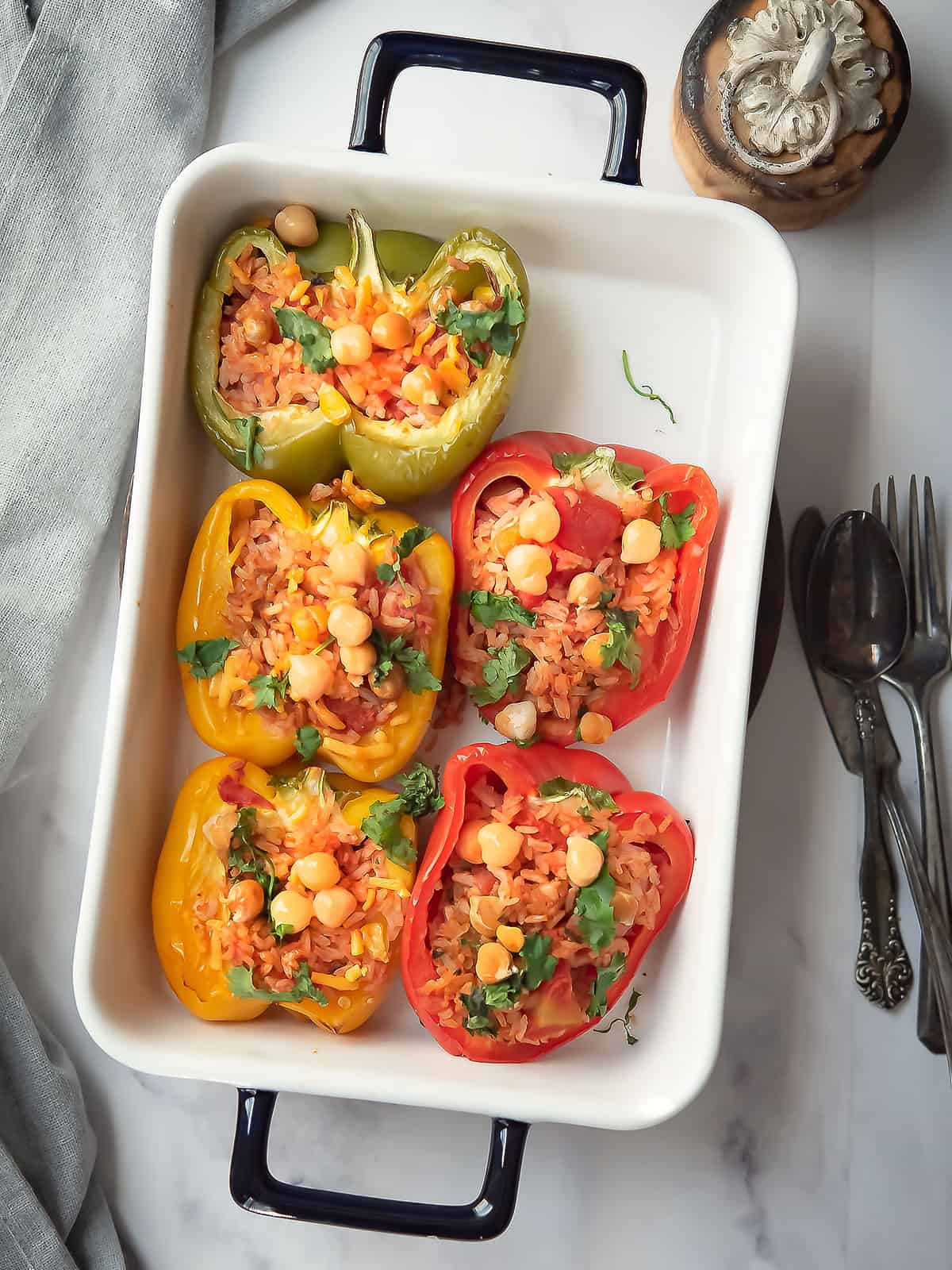Chickpea stuffed peppers garnished with cilantro on a plate