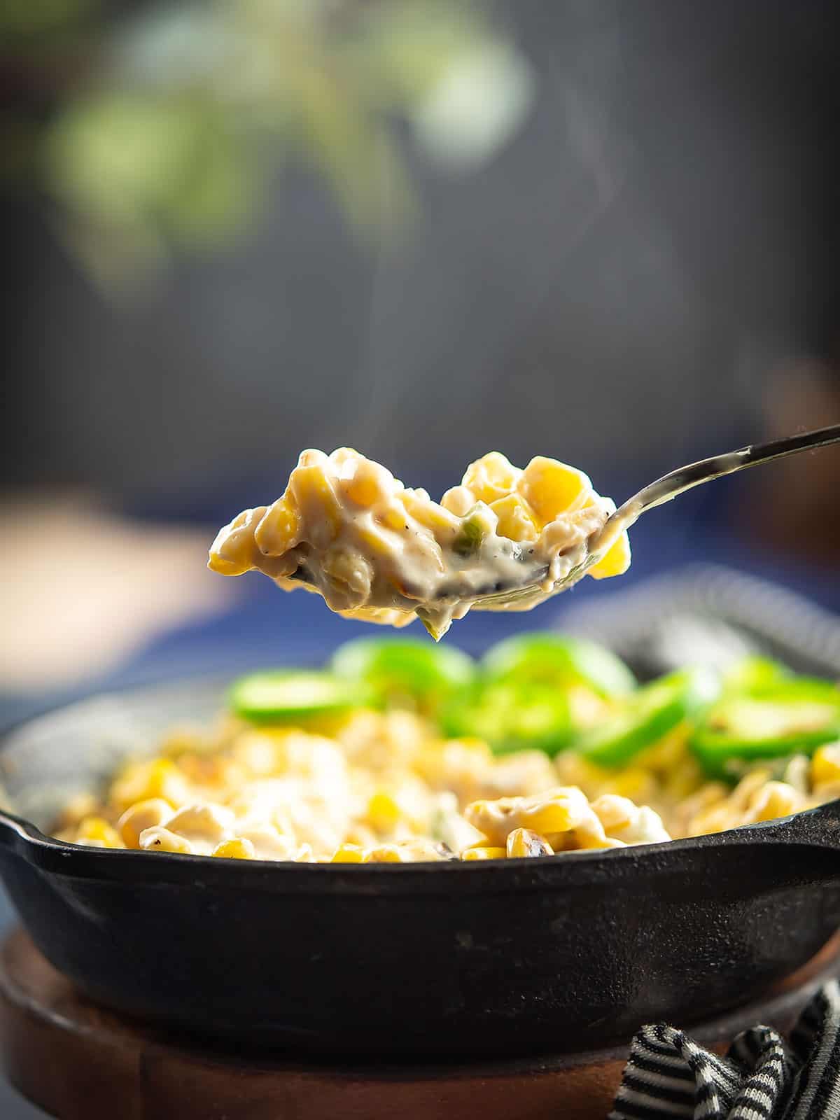 creamy jalapeno corn ready to eat with spoon