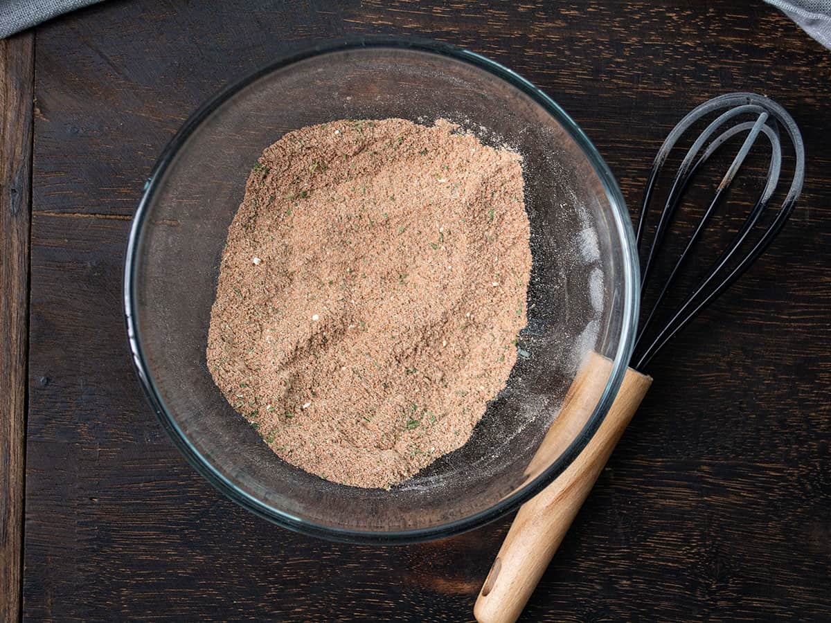 Container filled with homemade Cuban seasoning ready for use.