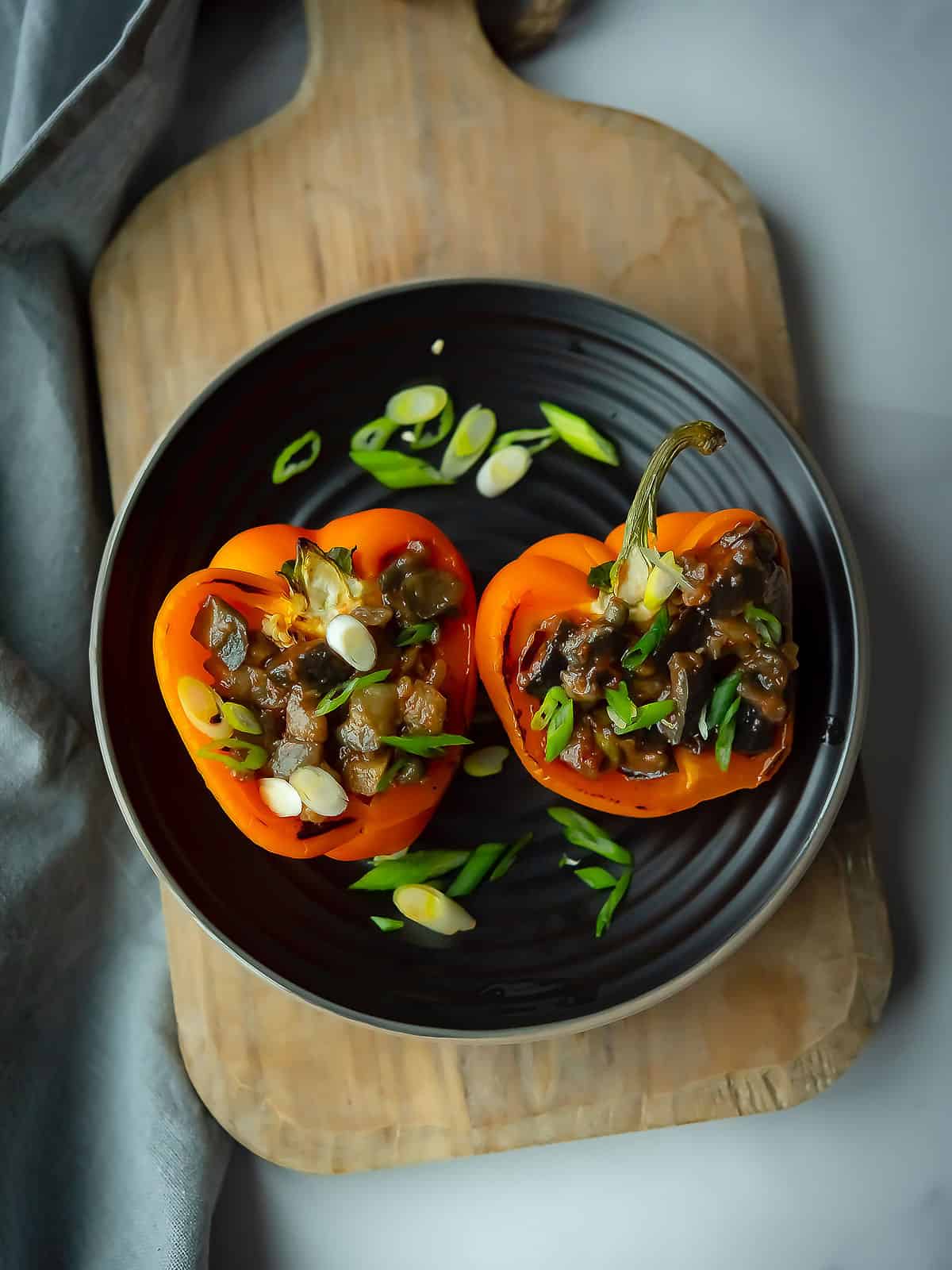 Delicious eggplant stuffed peppers topped with cilantro