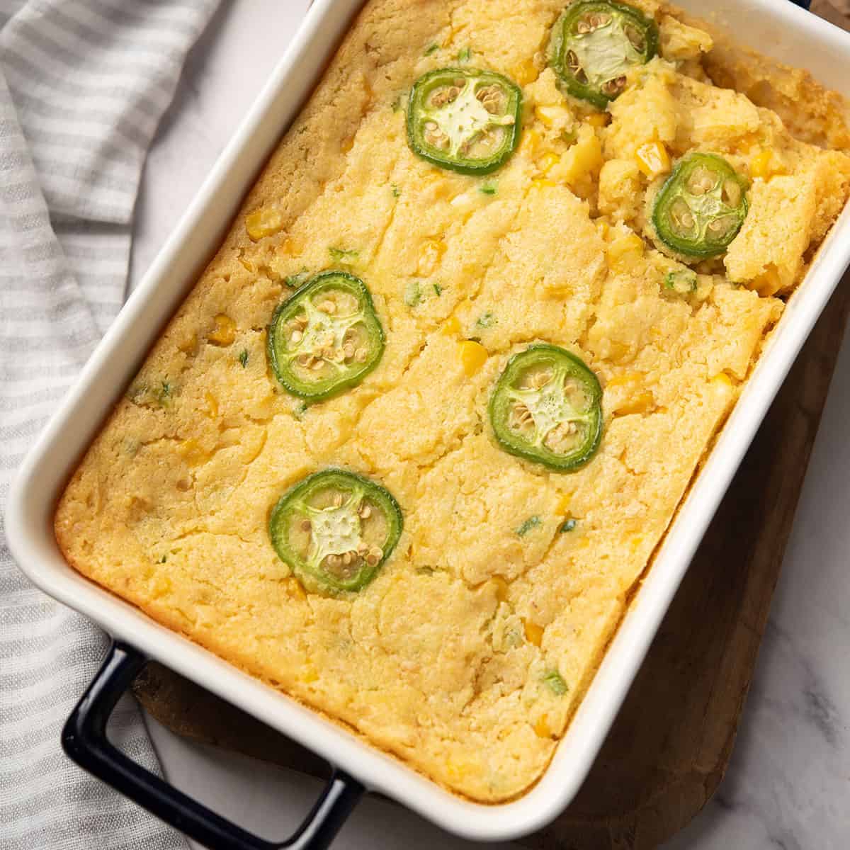 jalapeno corn casserole garnished with jalapeno slices