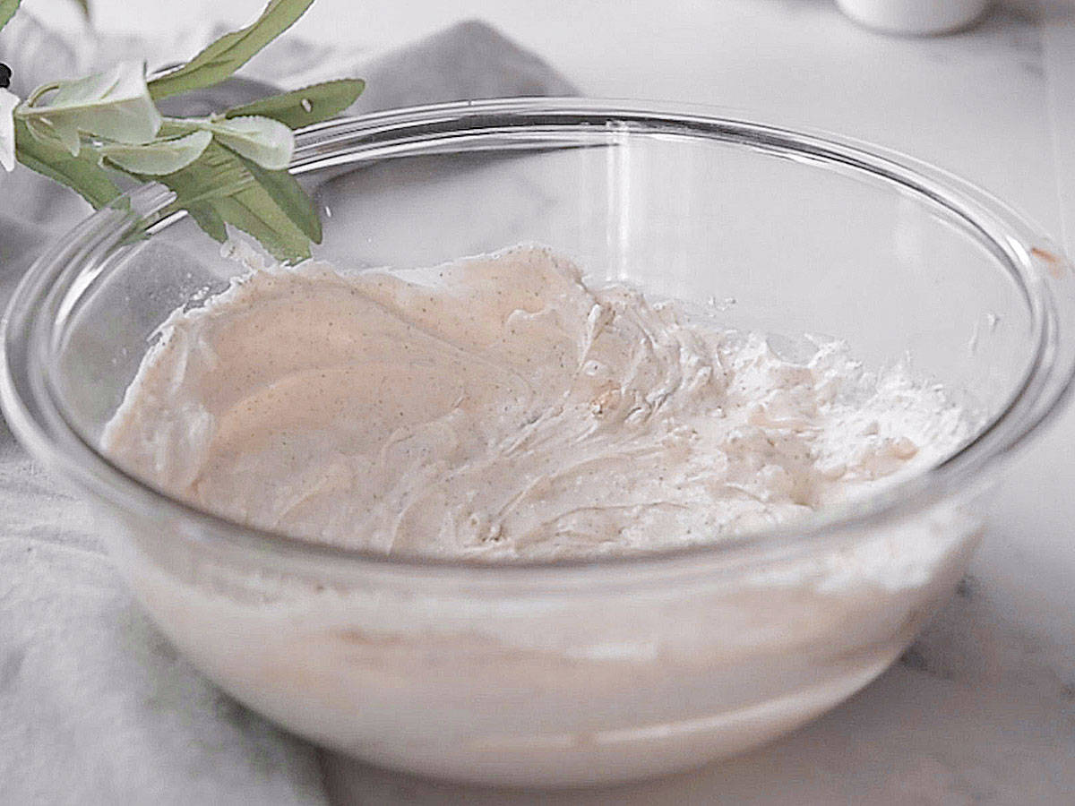Blending sour cream and cream cheese.
