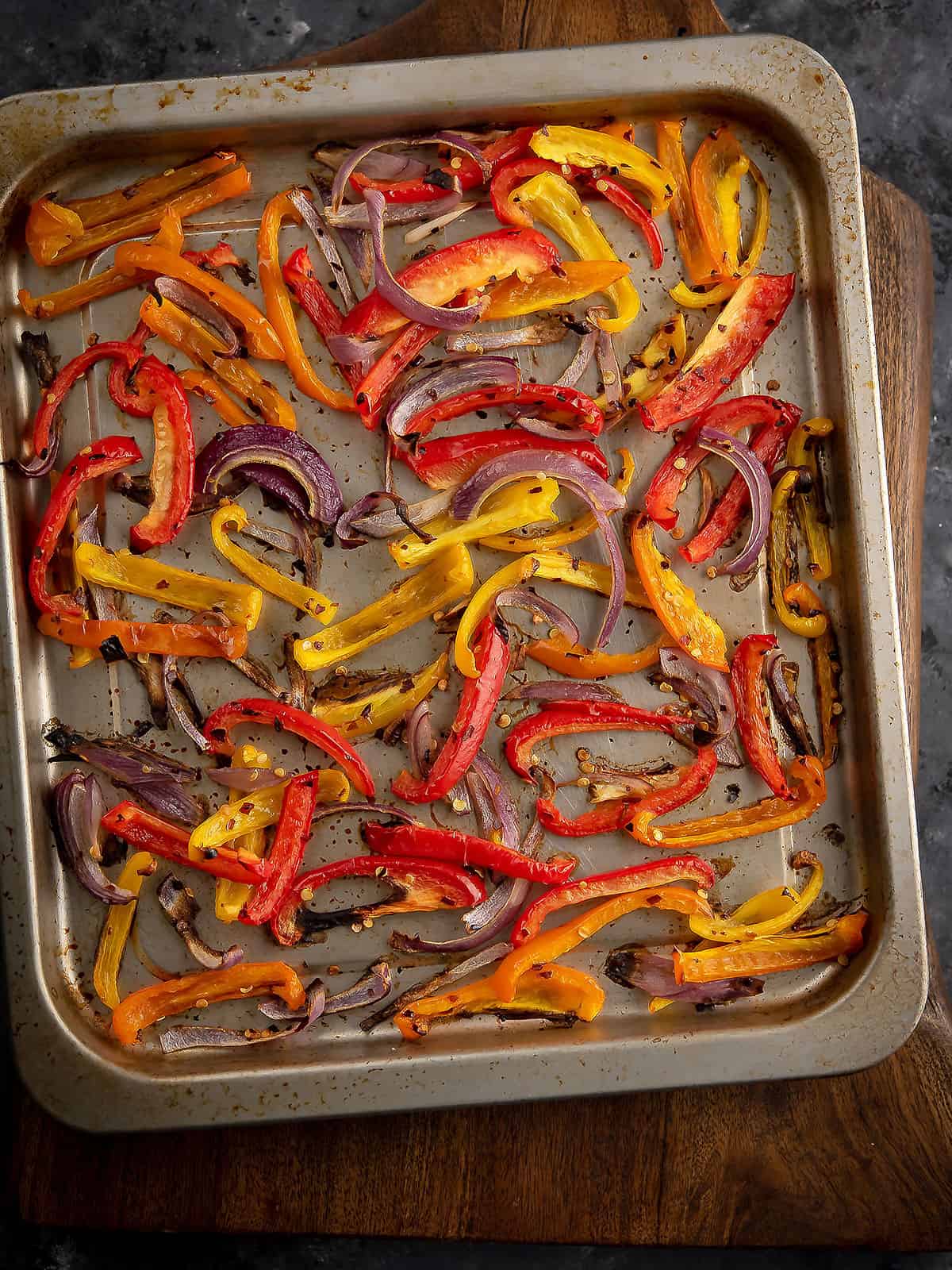 Golden brown roasted peppers and onions fresh out of the oven