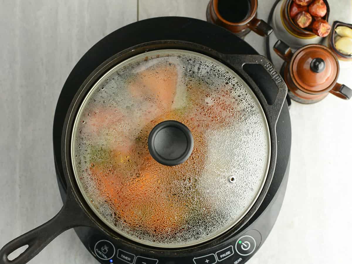 Finished Pepperonata simmering in a pan, ready to serve.
