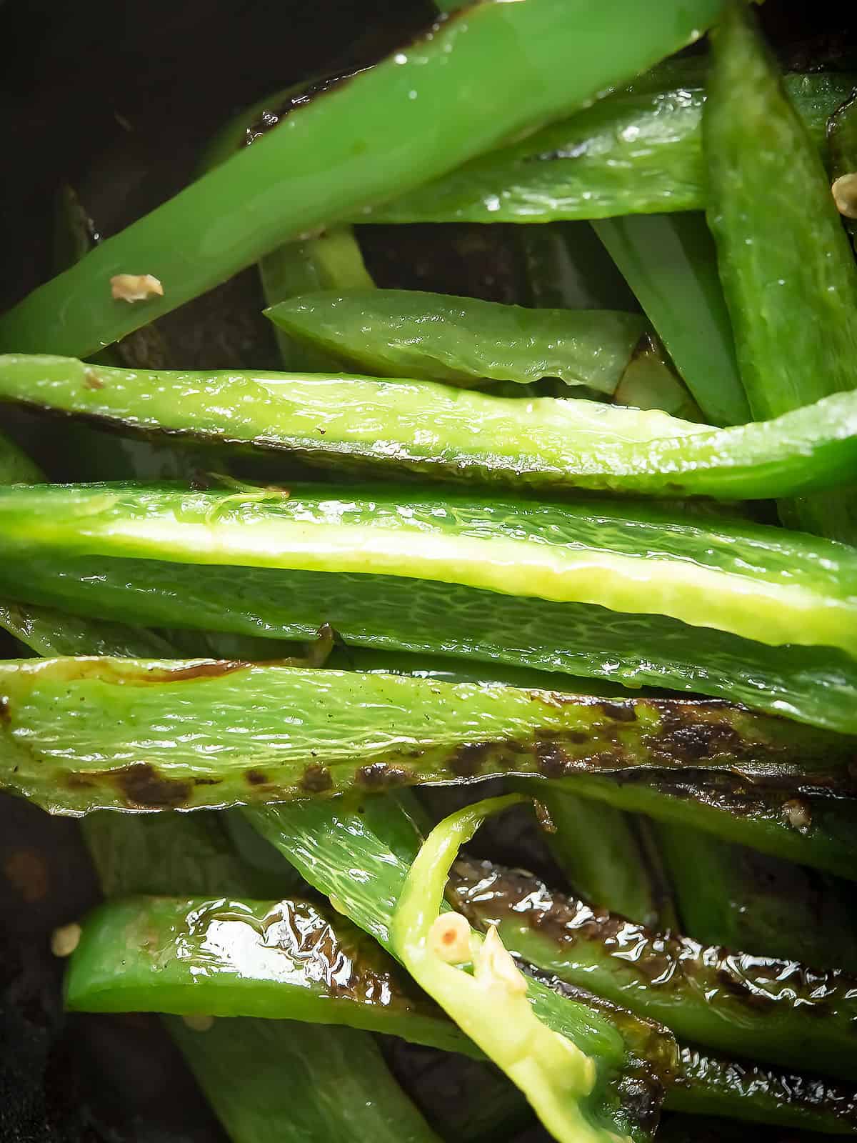Close-up of sautéed jalapeno showcasing its vibrant color and texture.