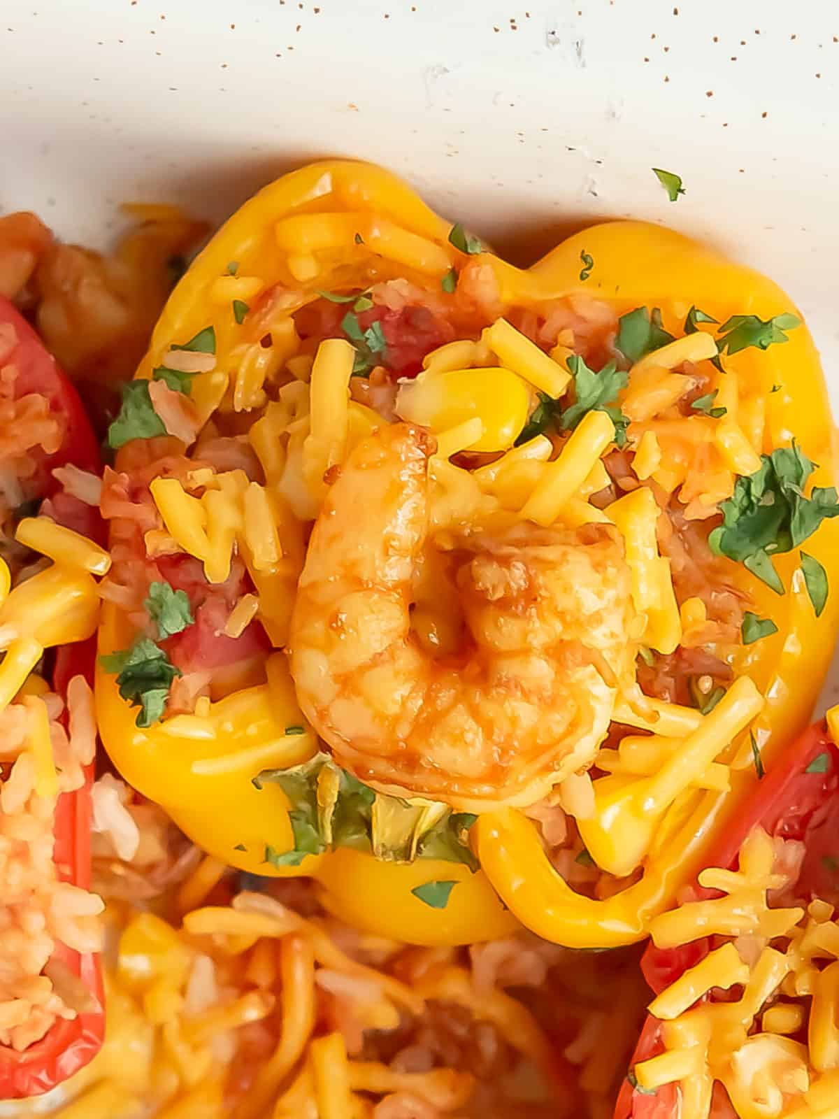 Delicious seafood stuffed peppers on a plate, ready to serve.