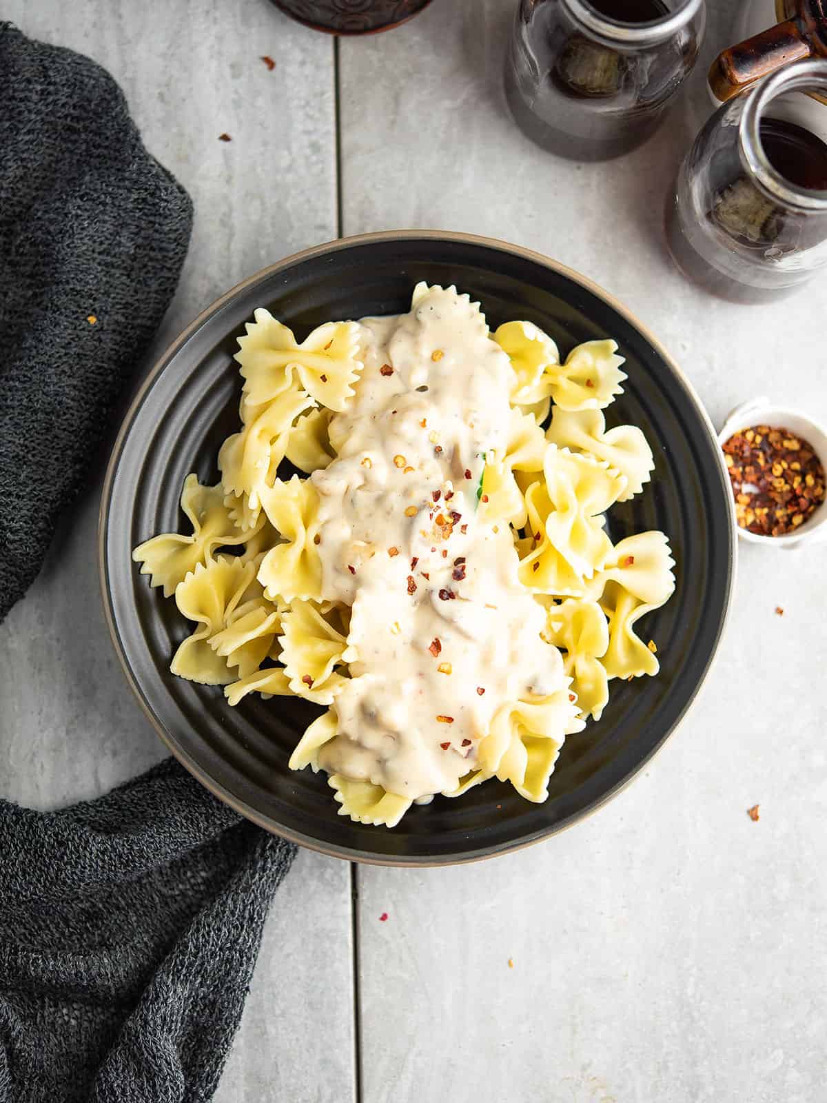 Creamy Spicy Alfredo Pasta Sauce served with pasta.
