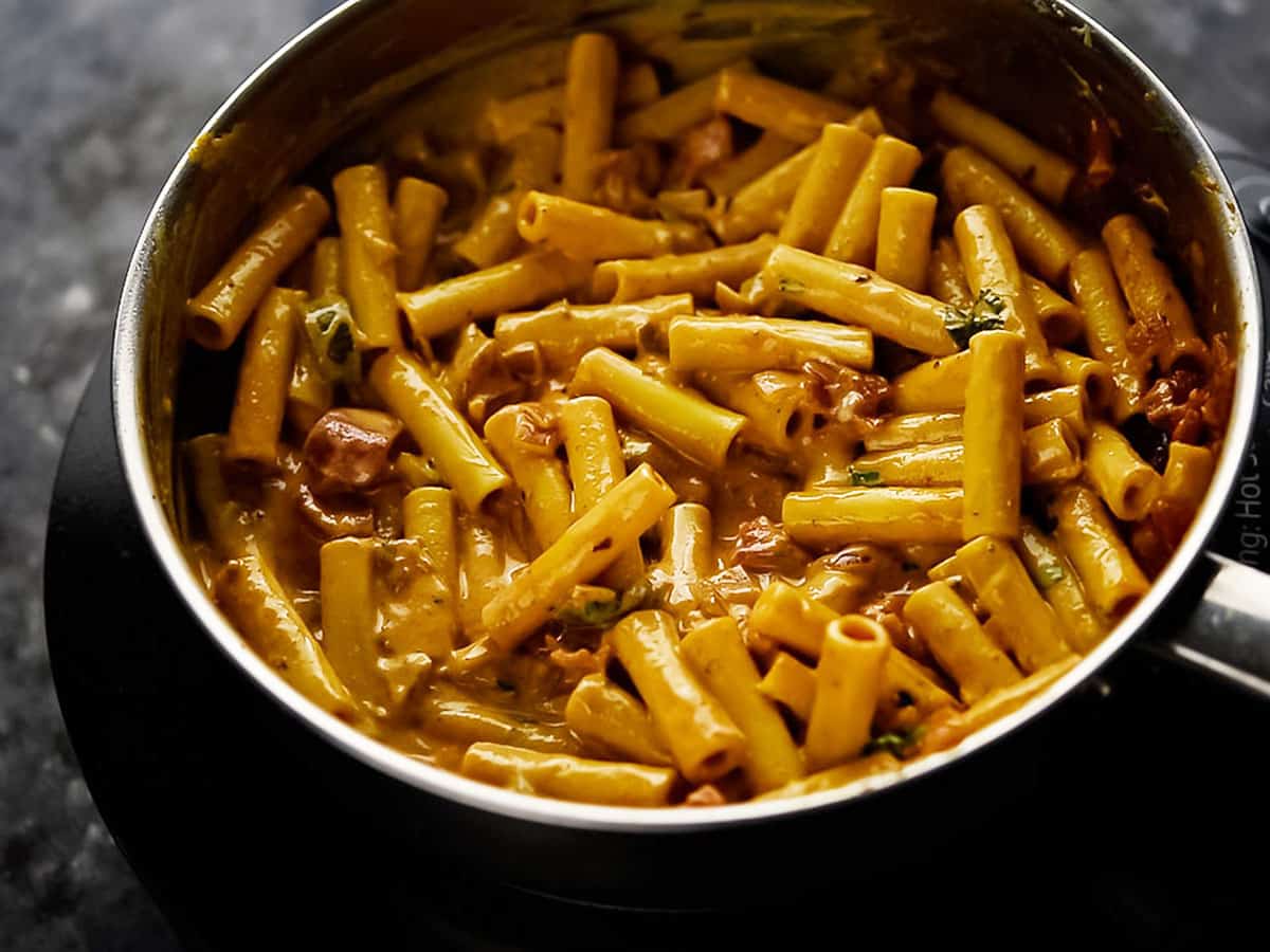 pasta tossed into the sauce