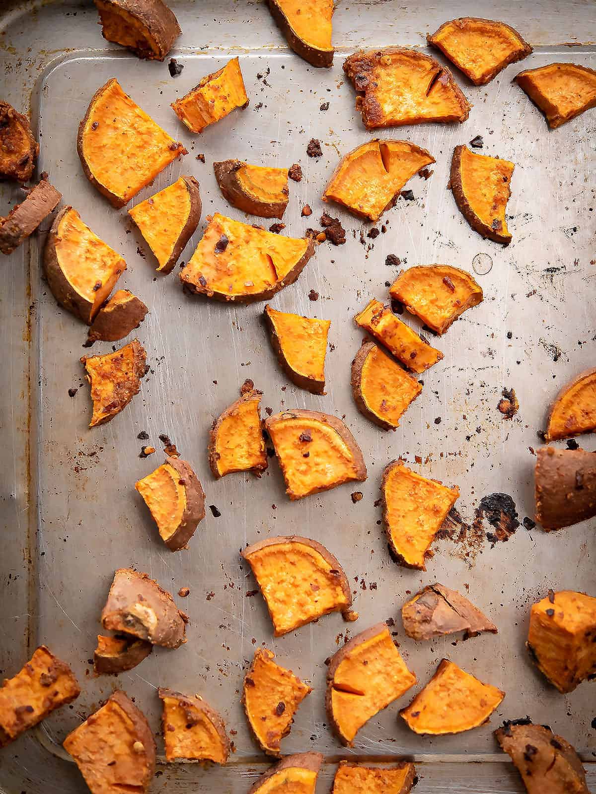 Close-up of crispy golden roasted sweet potato cubes.