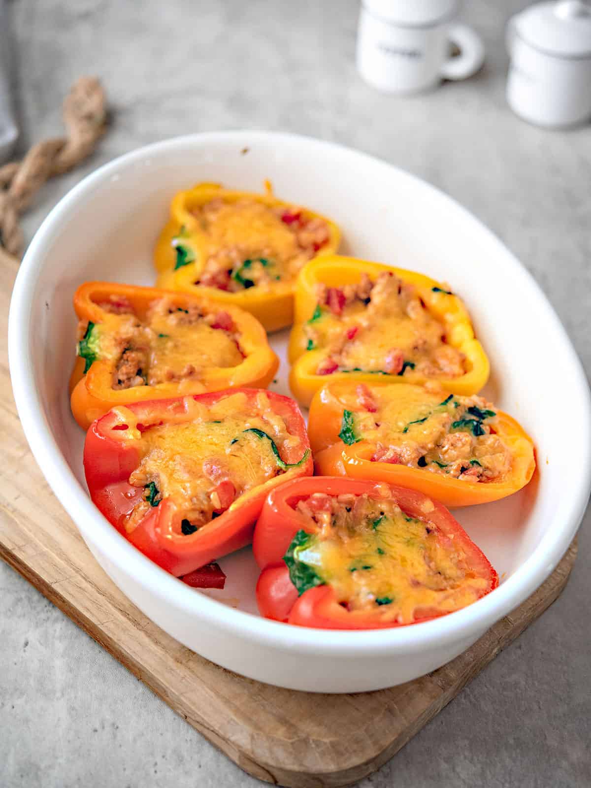 Delicious turkey stuffed peppers fresh out of the oven, topped with melted cheese.