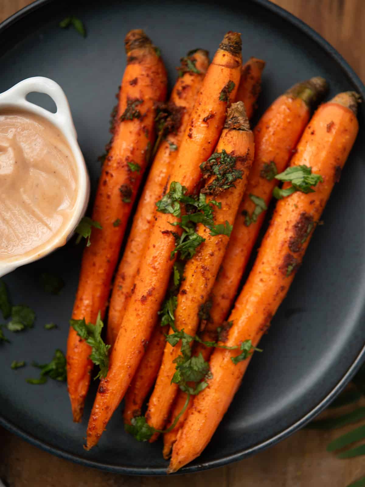Close-up of roasted carrots showing a crispy texture and vibrant colors.