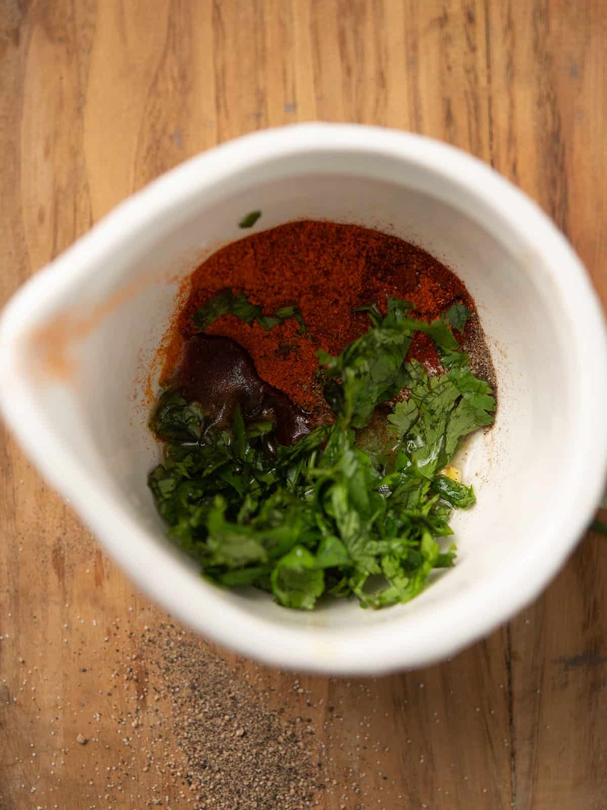 Mixing the spice blend in a bowl
