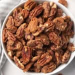 Bowl of spicy candied pecans ready to serve.