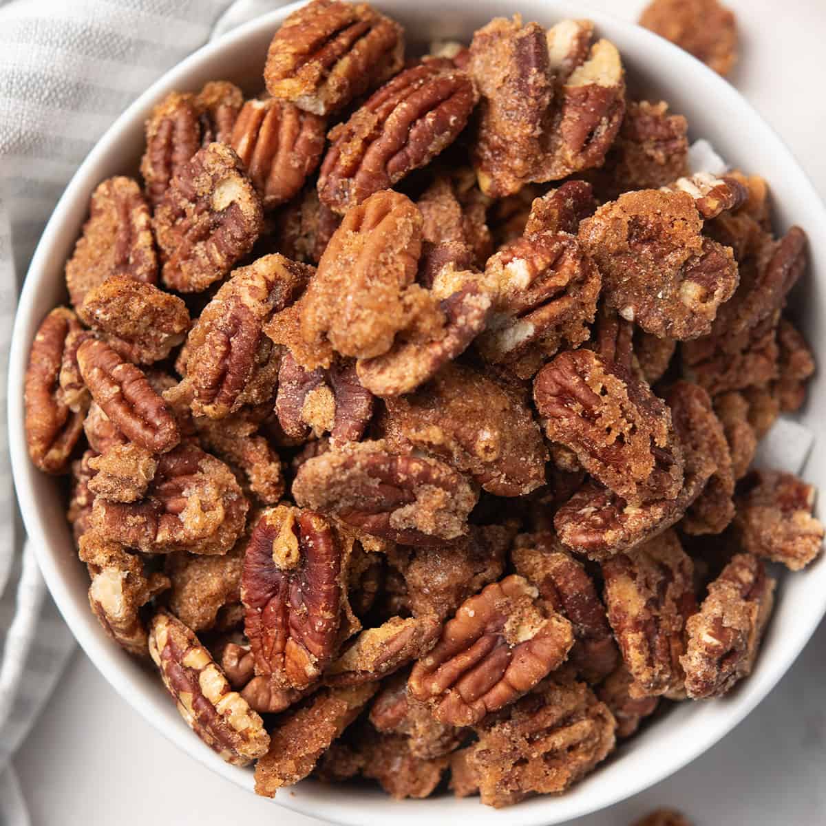 Bowl of spicy candied pecans ready to serve.